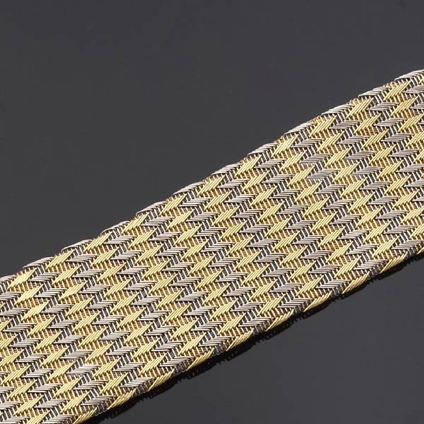 Appraisal: An eighteen karat yellow and white gold wide flexible bracelet