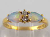 Appraisal: And carat gold opal and diamond ring opals approx mm