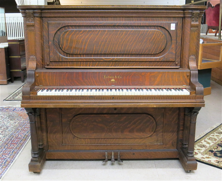 Appraisal: AN AMERICAN OAK UPRIGHT GRAND PIANO Ludwig Co New York