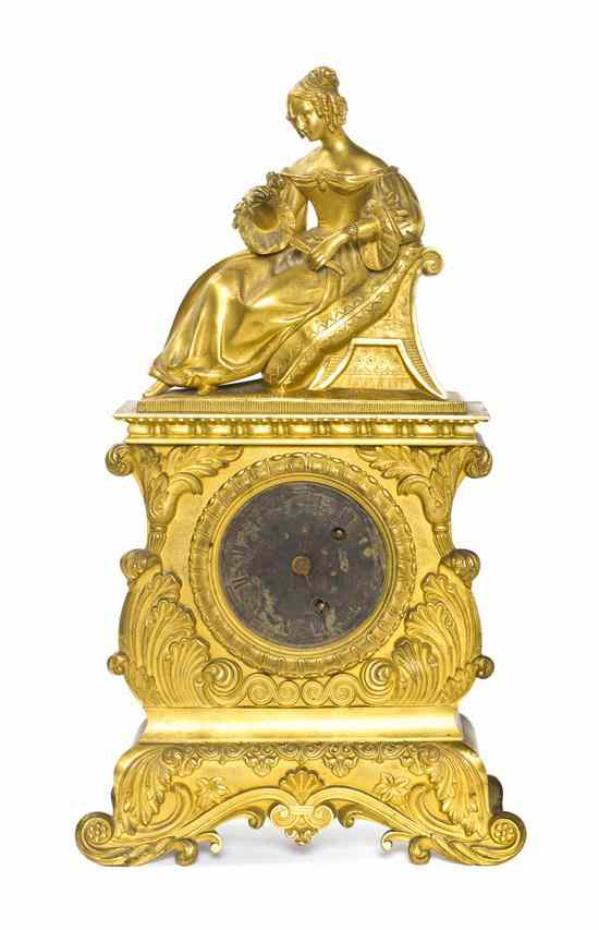 Appraisal: A French Gilt Bronze Figural Mantel Clock cast with a