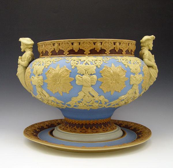 Appraisal: METTLACH PUNCH BOWL TUREEN UNDERPLATE Stoneware tureen with applied figural