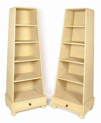 Appraisal: A pair of painted pyramid open bookcases each with a