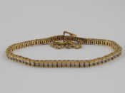 Appraisal: A yellow metal tests carat gold diamond line bracelet estimated