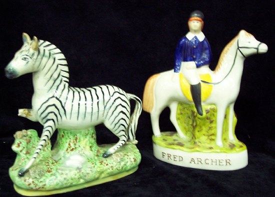 Appraisal: A Staffordshire figure of a zebra and another Staffordshire figure