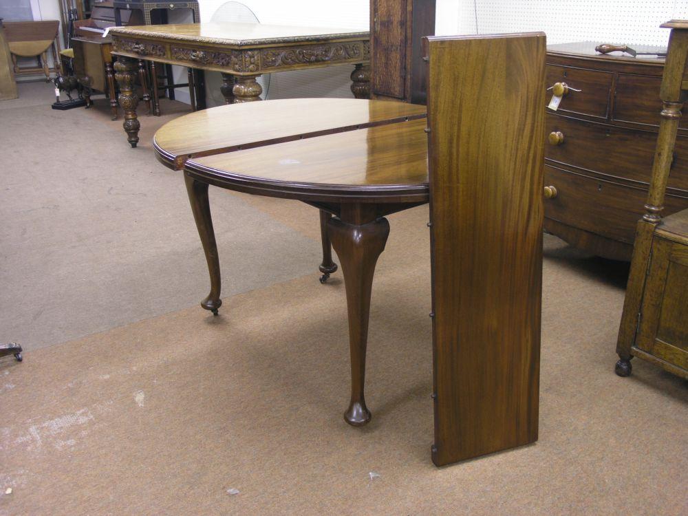 Appraisal: A George V oval mahogany dining table with extra leaf