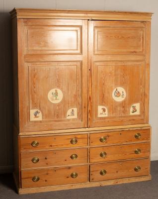 Appraisal: A housemaid's pine cupboard with drawers beneath cm wide