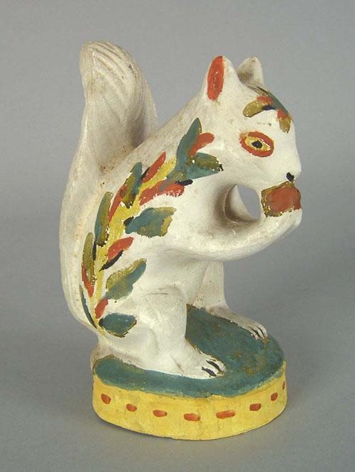 Appraisal: Chalkware figure of a squirrel th c retaining a vibrant