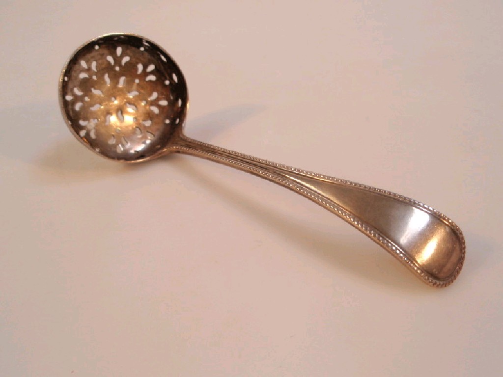 Appraisal: A Victorian silver bead pattern sifter spoon Maker George Angel