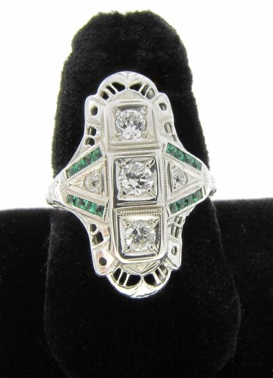 Appraisal: A vintage K white gold ring featuring three center round