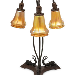 Appraisal: A Cast Metal Three-Light Lamp with Quezal Aurene Glass Shades