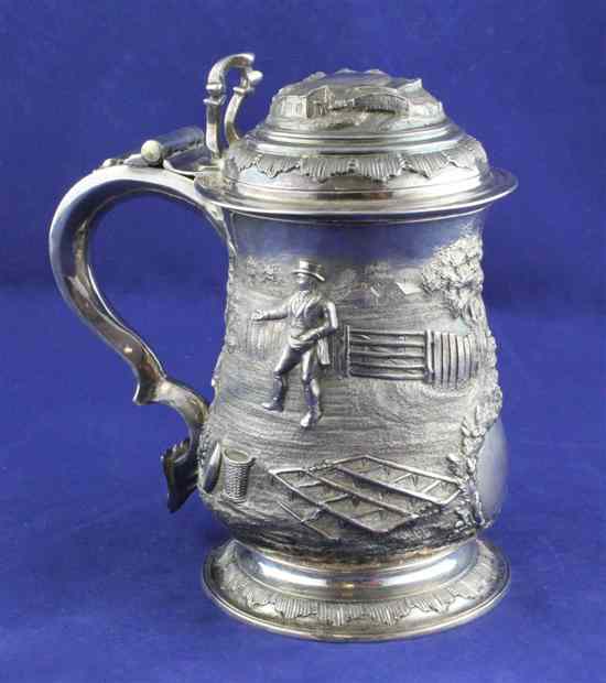 Appraisal: A George II silver baluster tankard with later embossed decoration