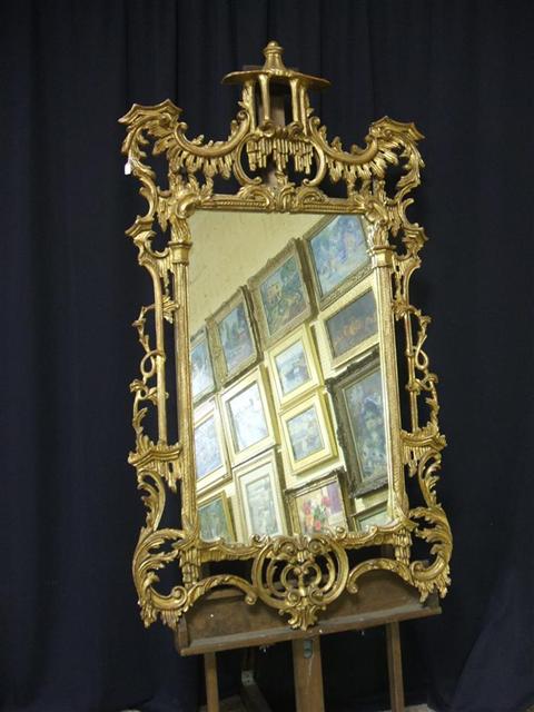 Appraisal: CHIPPENDALE STYLE HALL MIRROR Carved with elaborate openwork rockery and