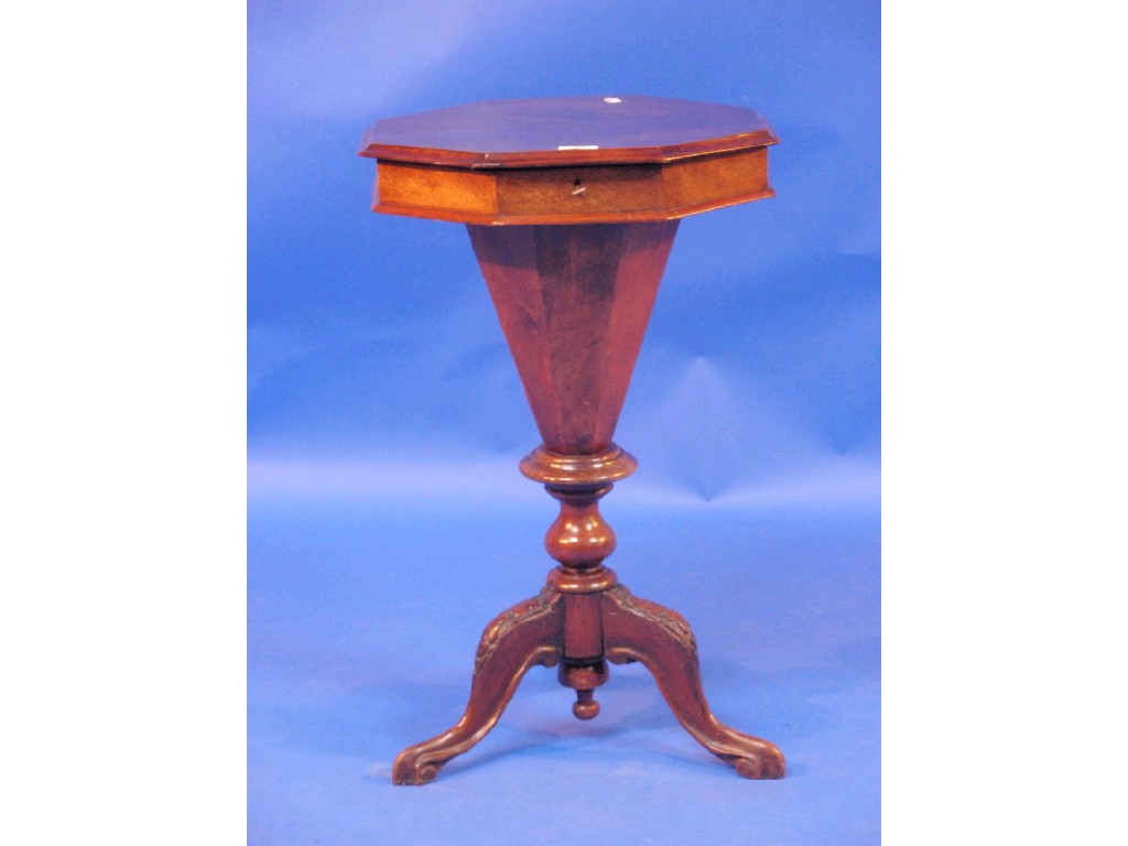 Appraisal: A Victorian figured walnut trumpet sewing table with lift top