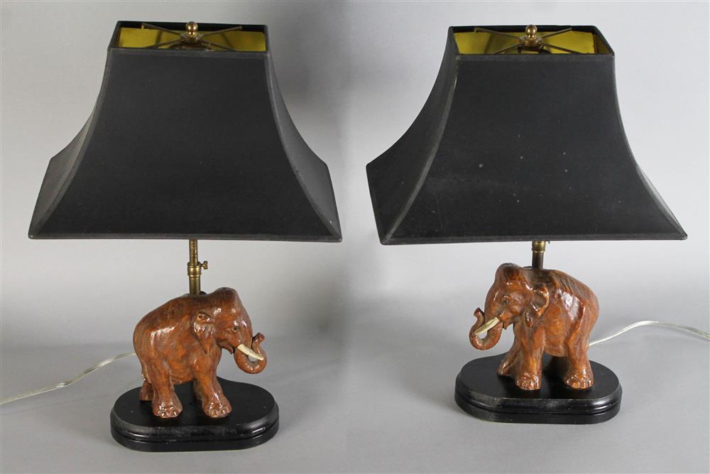 Appraisal: PAIR OF CARVED WOOD ASIAN ELEPHANT LAMPS WITH BLACK SHADES