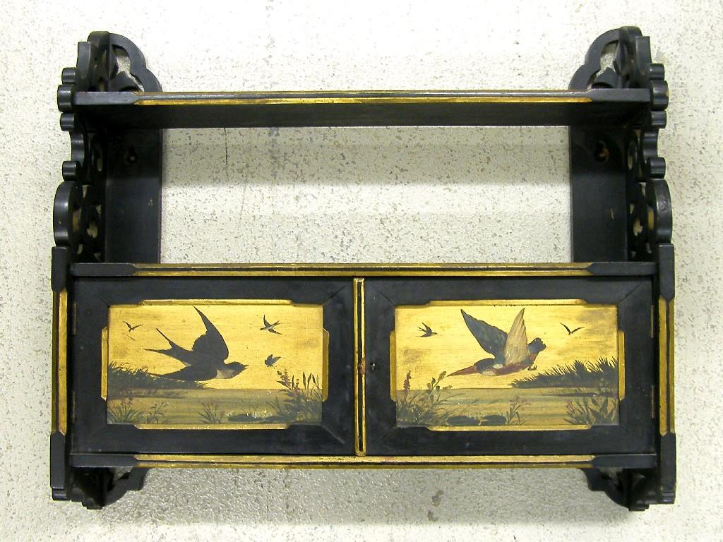 Appraisal: Aesthetic Movement ebonised hanging wall cabinet the raised shelved back