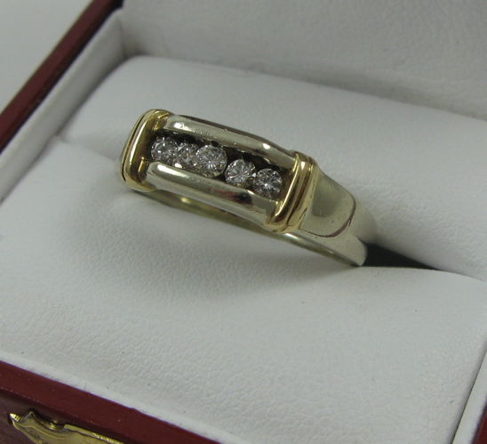 Appraisal: FIVE-DIAMOND RING K yellow gold the five round-cut diamonds having