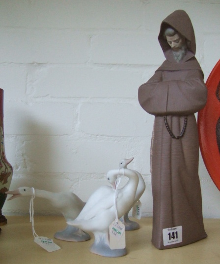 Appraisal: A Lladro figure of a monk and three geese