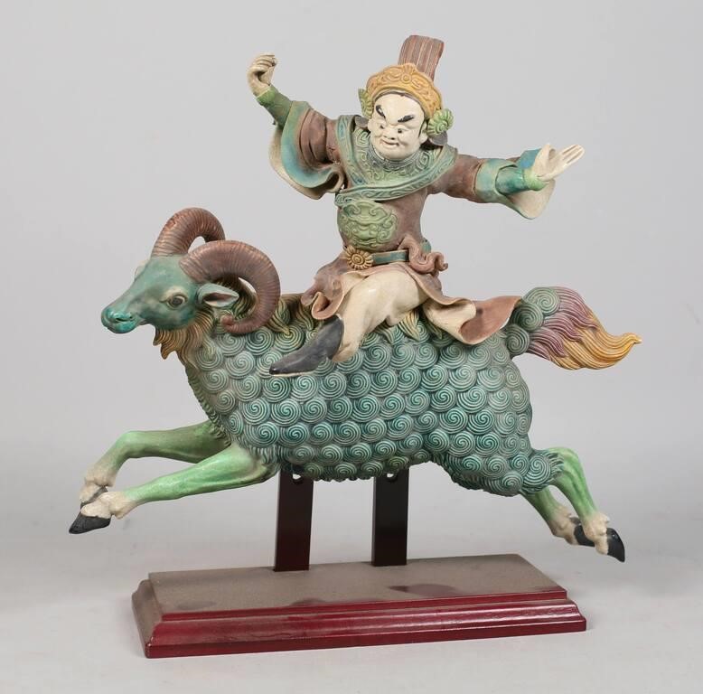 Appraisal: Chinese ceramic roof tile statue of a man riding a