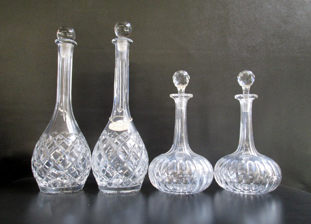 Appraisal: FOUR CRYSTAL DECANTERS two of matching patterns with an elongated