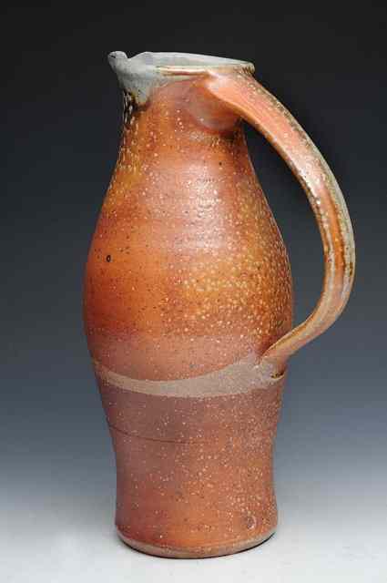 Appraisal: Lisa Hammond British b A tall stoneware soda glazed jug