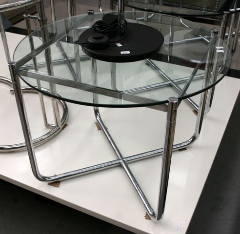 Appraisal: A pair of chromed tubular steel and glass topped circular