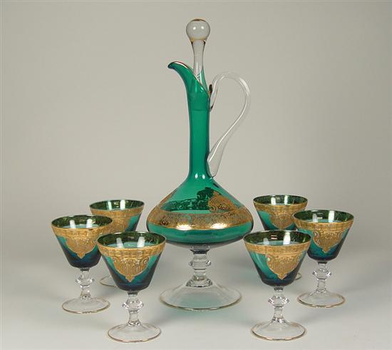 Appraisal: Deep Teal Footed Decanter Six Glasses clear footed and stem