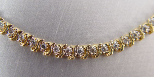 Appraisal: K CTW TENNIS BRACELET K yellow gold bracelet contains round