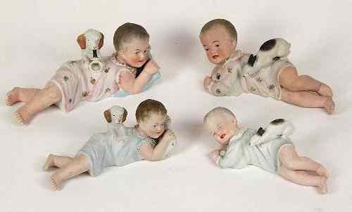 Appraisal: Four German bisque Piano Baby models a girl with a