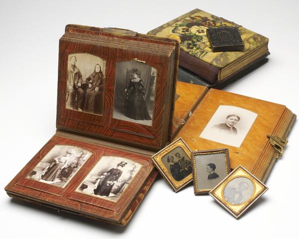 Appraisal: VICTORIAN PHOTOGRAPHY Three photo albums together with one postcard album