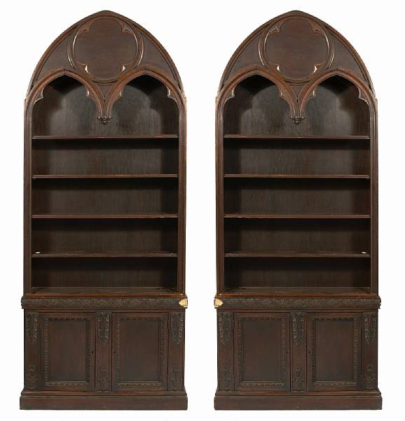 Appraisal: A pair of Gothic Revival oak bookcases height ft in