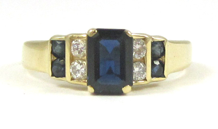 Appraisal: SAPPHIRE DIAMOND AND FOURTEEN KARAT GOLD RING with two round-cut