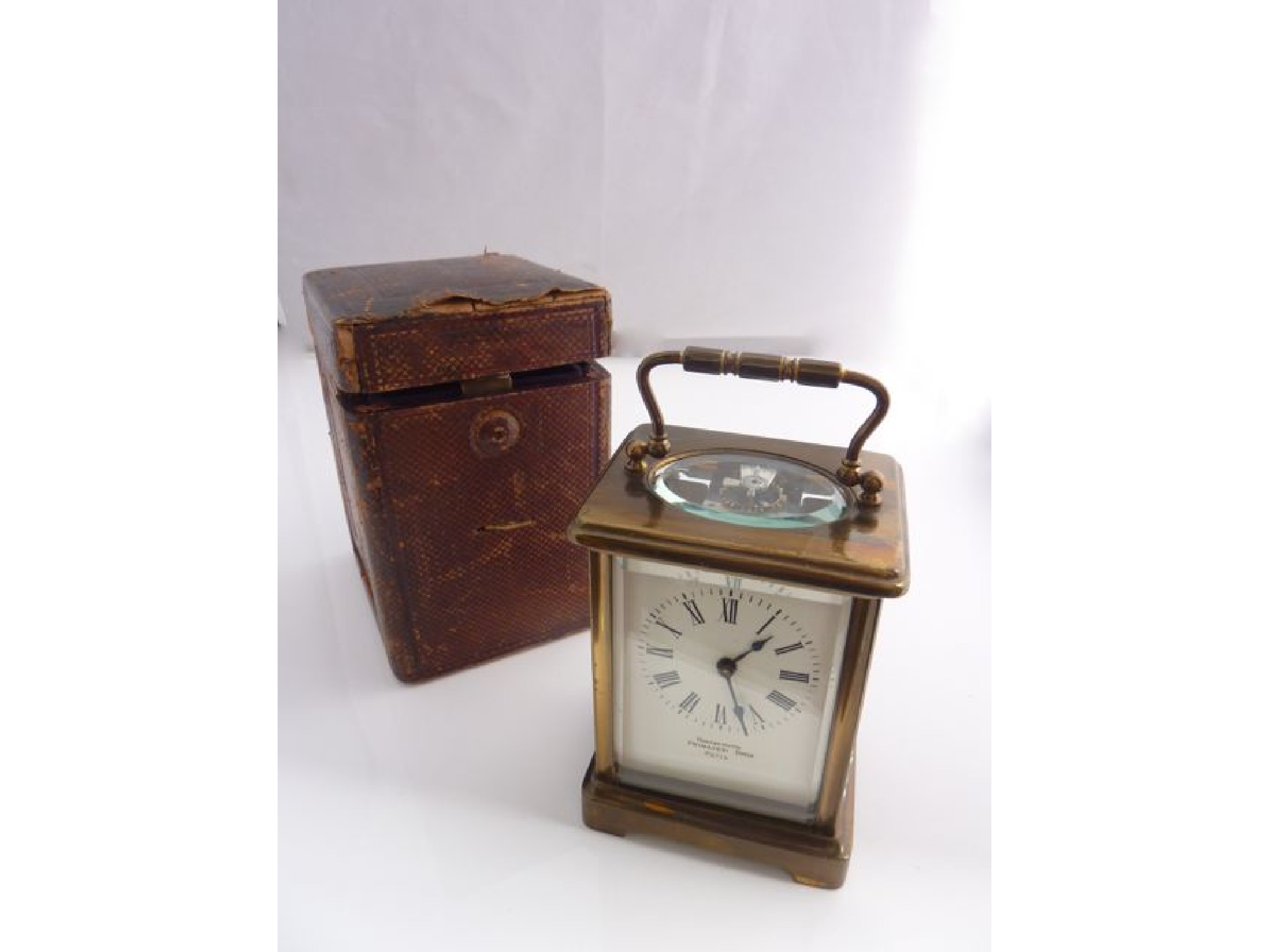 Appraisal: A French carriage clock with eight day timepiece in red