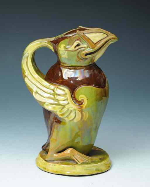 Appraisal: C H Brannum of BarumAn earthenware puffin jug painted in