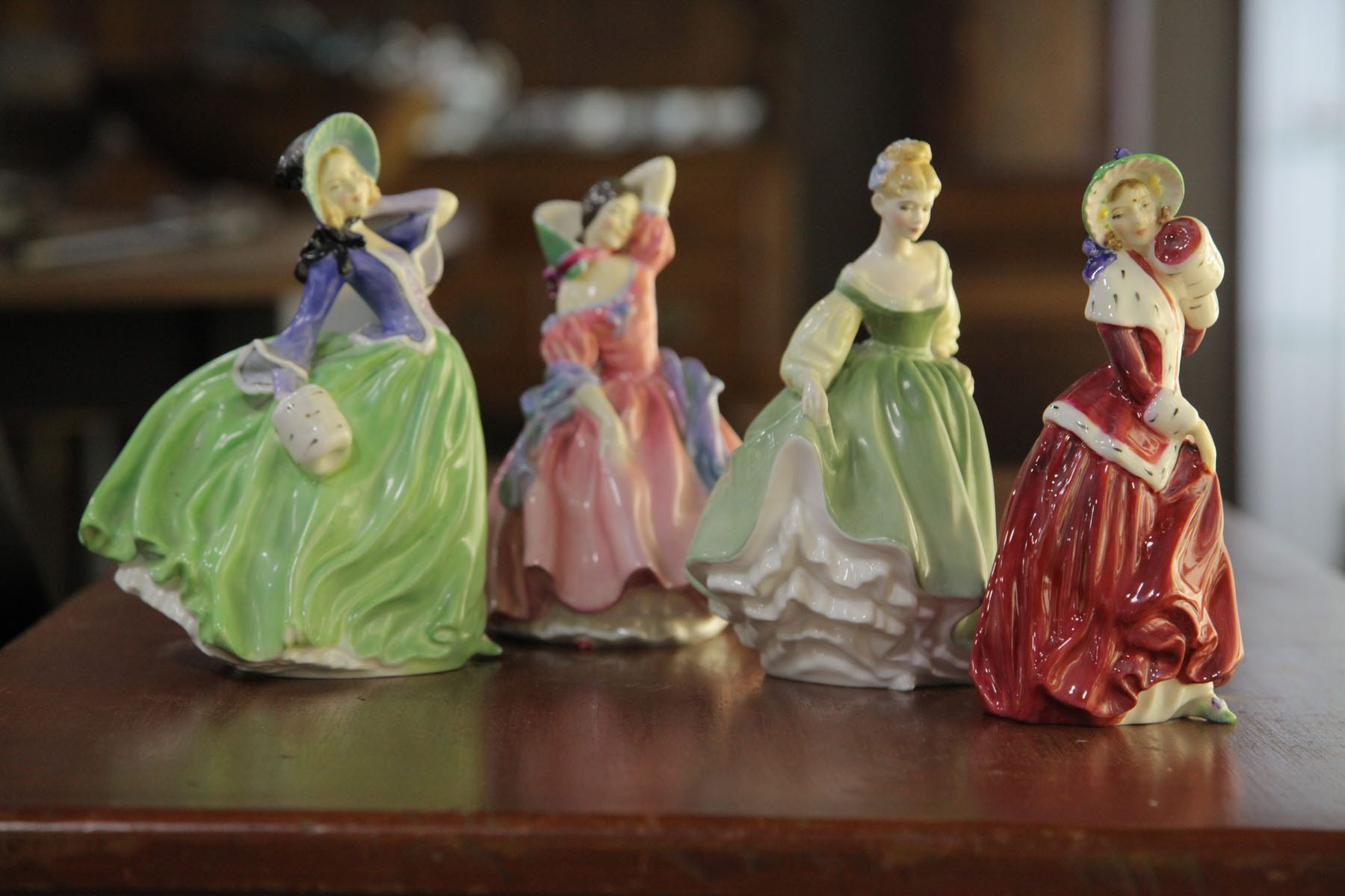 Appraisal: FOUR ROYAL DOULTON FIGURES English th century Fair Lady HN