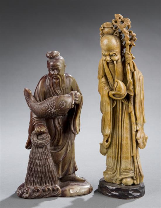 Appraisal: Pair of soapstone figures Highly detailed fisherman holding a fish