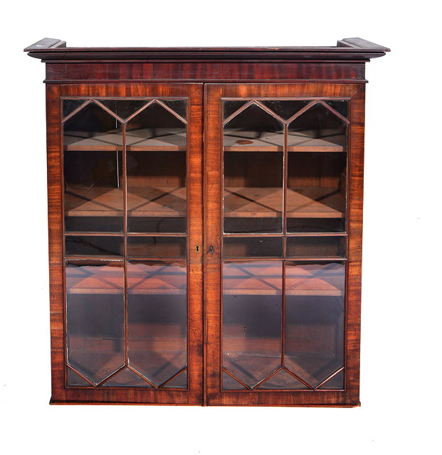 Appraisal: A TH CENTURY MAHOGANY BOOKCASE CABINET TOP the doors opening