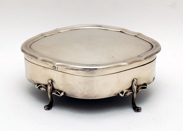 Appraisal: Small footed trinket box with floral formed legs Hallmarked for