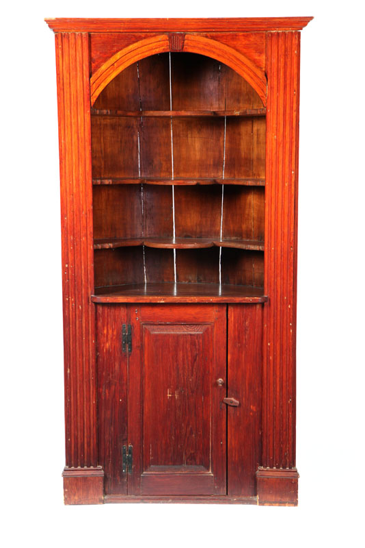 Appraisal: BARREL-BACK CORNER CUPBOARD American late th-early th century pine One-piece