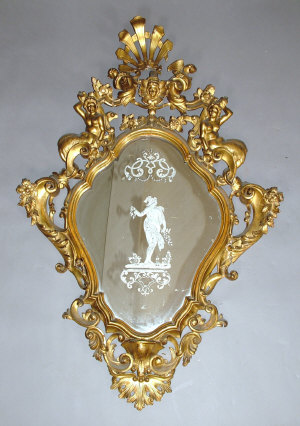 Appraisal: A Rococo style giltwood wall mirror th century the heavily