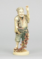 Appraisal: A Polychrome Ivory Carving of a Peasant A very nice