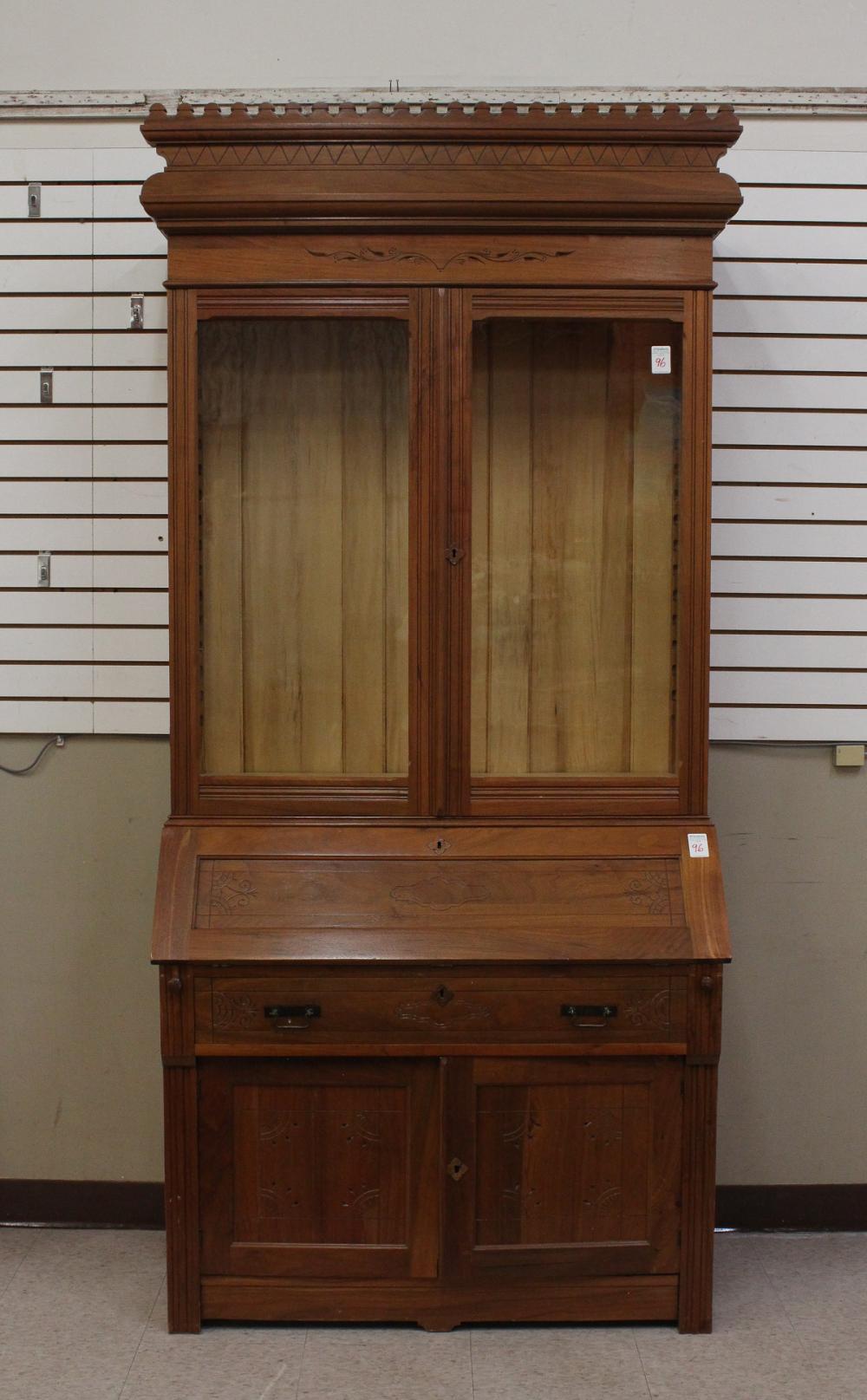 Appraisal: VICTORIAN WALNUT SLANT-FRONT SECRETARY BOOKCASE Charles Eastlake design last quarter