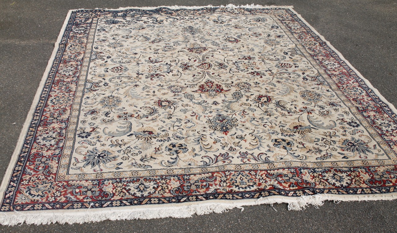 Appraisal: An early thC rug in floral pattern predominantly in red