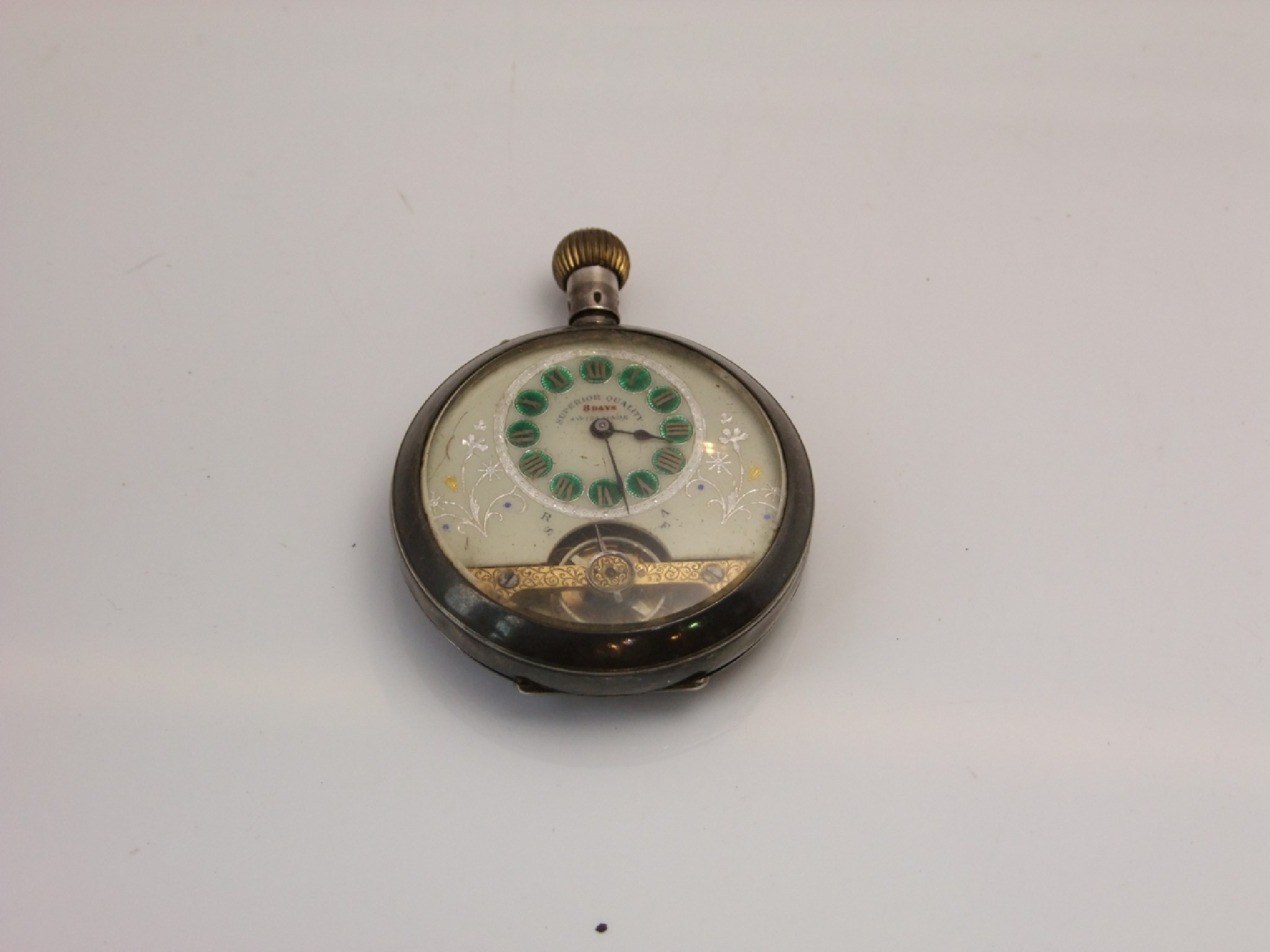 Appraisal: A base metal open-faced pocket watch with visible escapement dial