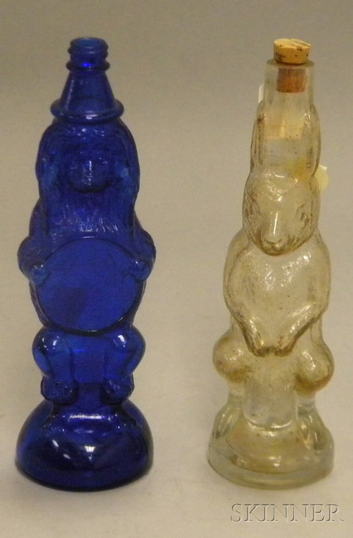 Appraisal: Colorless Molded Rabbit Figural Bottle and a Cobalt Molded Glass