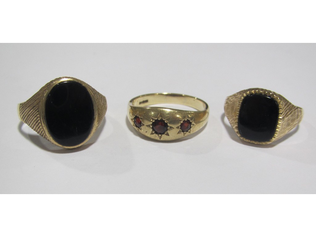 Appraisal: Lot comprising two ct gold onyx set dress rings and