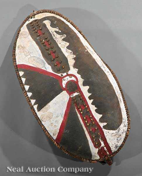 Appraisal: A Kenyan Painted Hide Shield probably Massai of oval form