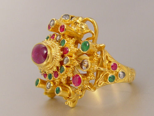 Appraisal: K DIAMOND RUBY EMERALD RING In a very subtle dragon