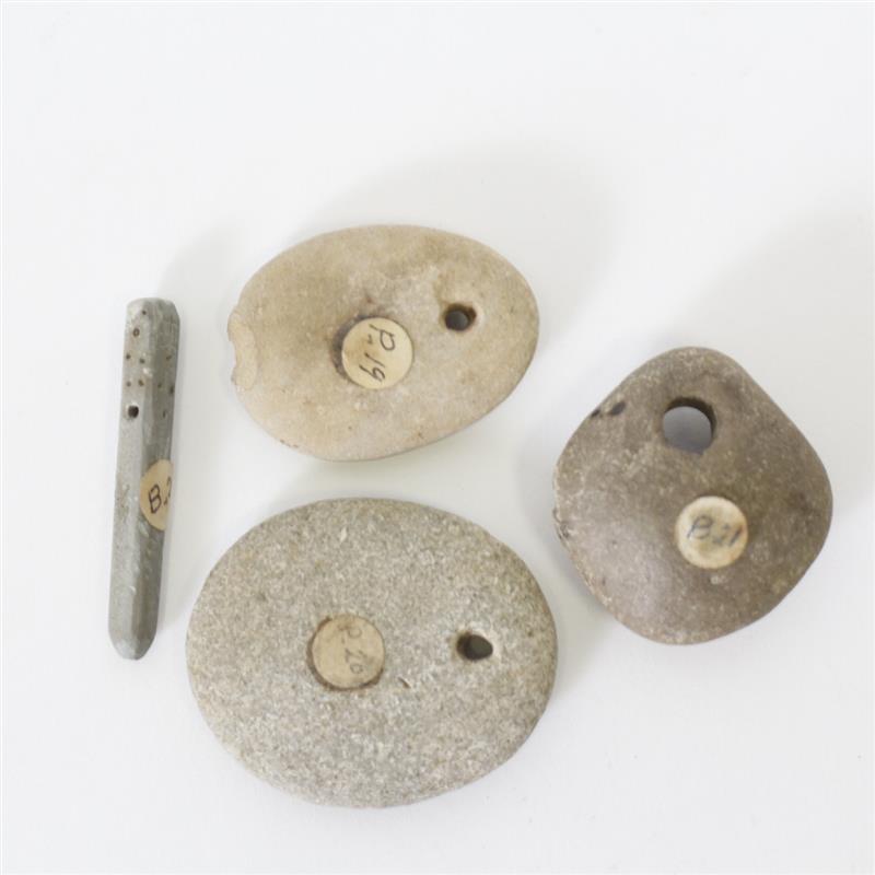 Appraisal: Four Misc Drilled Stone Objects Longest