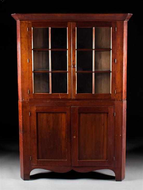 Appraisal: Federal cherrywood glazed panel door corner cupboard Pennsylvania circa two