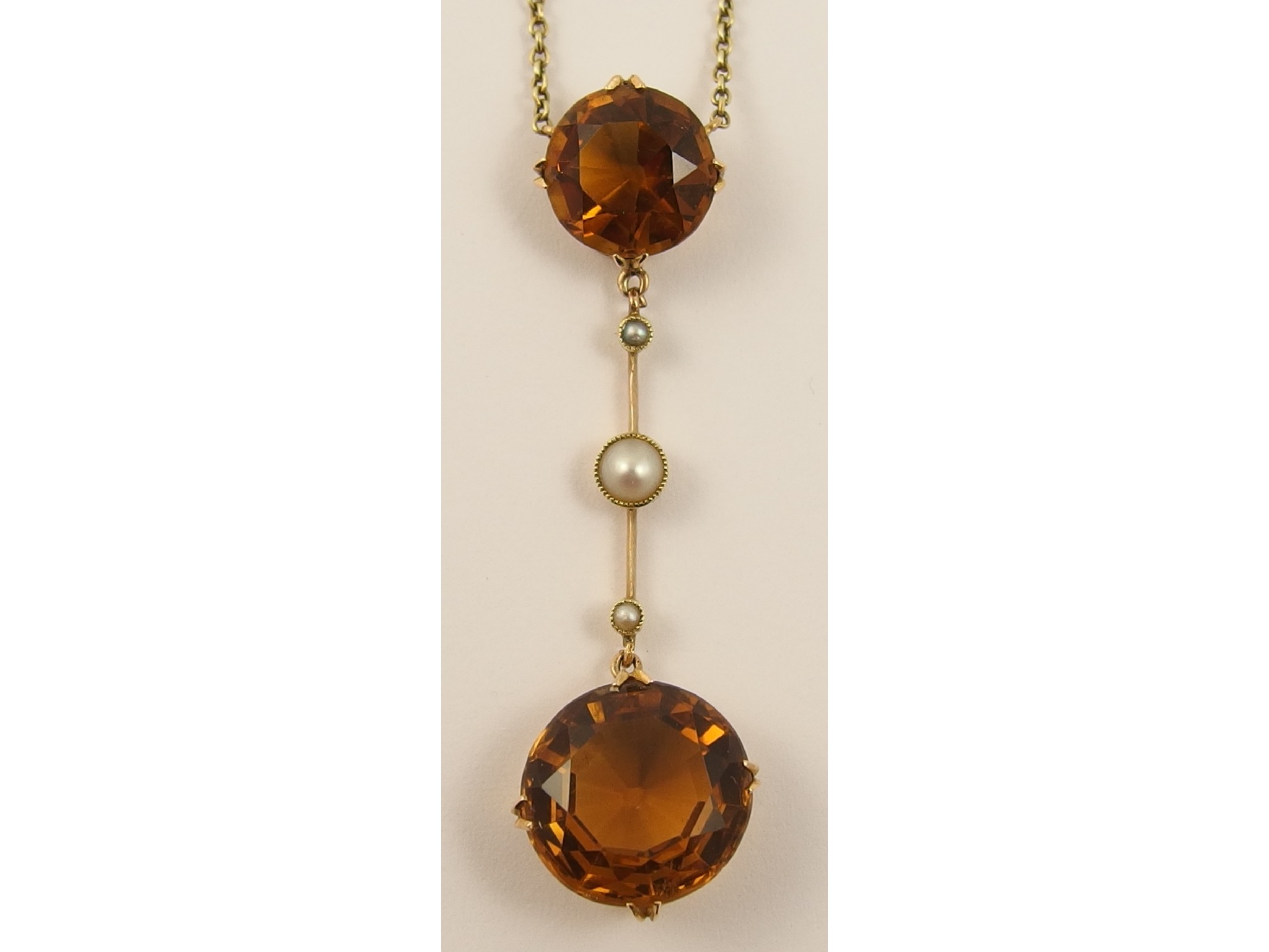 Appraisal: An Edwardian cognac citrine and pearl pendant neckletthe central citrine